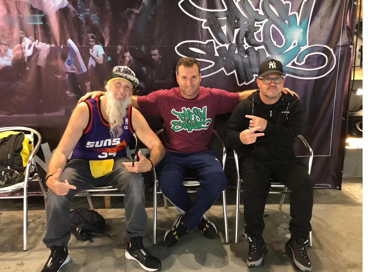 Tarik Erkustanlar with community members at Fresh Skillz CIC